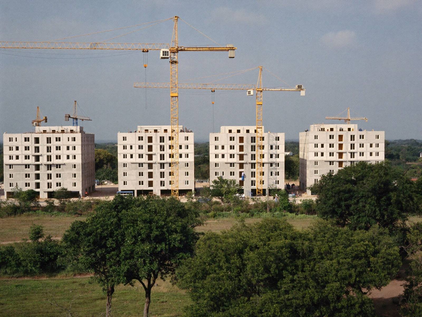 Apartment blocks under construction with tower cranes near Nairobi